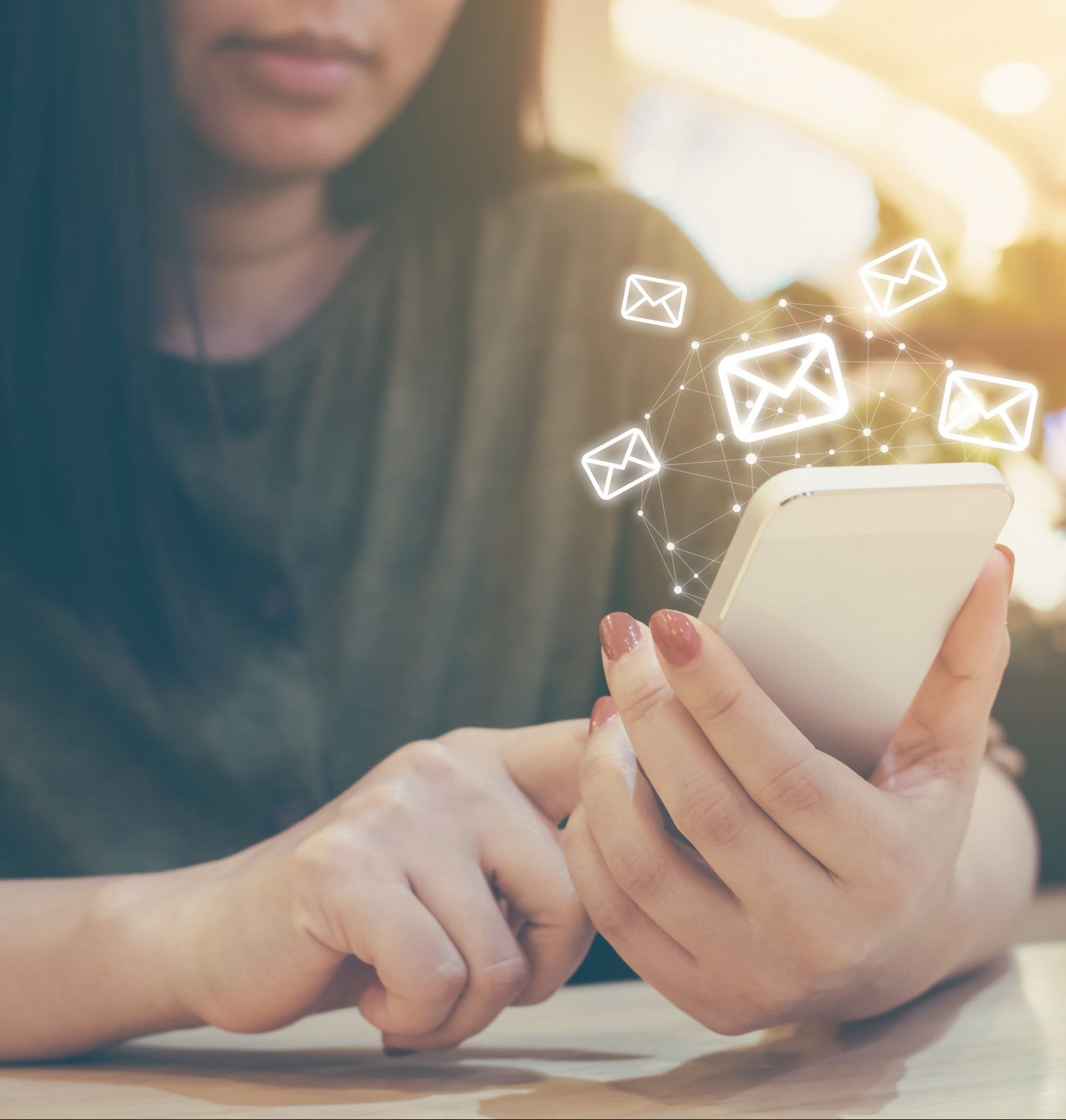 Happy woman hand using mobile phone with e-mail application